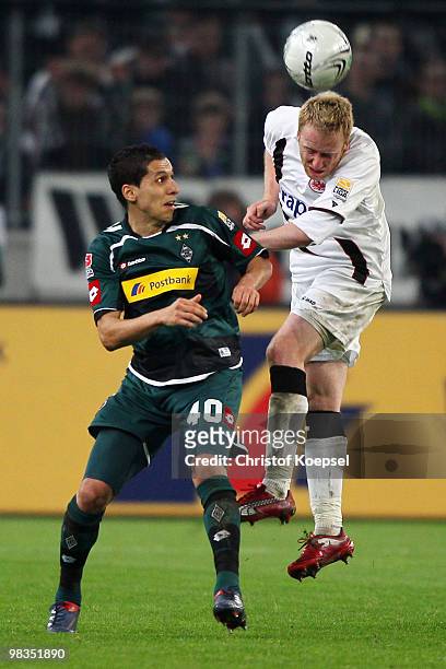 Karim Matmour of Gladbach and Patrick Ochs of Frankfurt jump for a header during the Bundesliga match between Borussia Moenchengladbach and Eintracht...