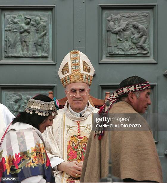Vatican's Cardinal Secretary of State Tarcisio Bertone officiates a mass in Concepcion, some 500 km south of Santiago on Abril 09, 2010. A massive...