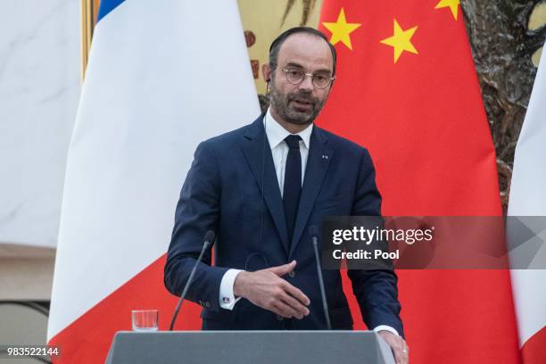 Prime Minister Edouard Philippe speaks to journalists during a press conference with China's Premier Li Keqiang at the Great Hall of the People on...