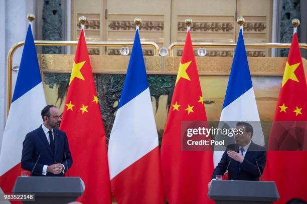 French Prime Minister Edouard Philippe and China's Premier Li Keqiang attend a joint press conference at the Great Hall of the People on June 25,...