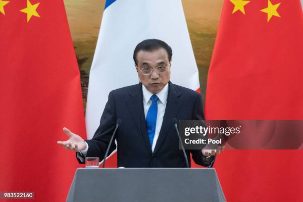 China's Premier Li Keqiang speaks to journalists during a press conference with French Prime Minister Edouard Philippe at the Great Hall of the...