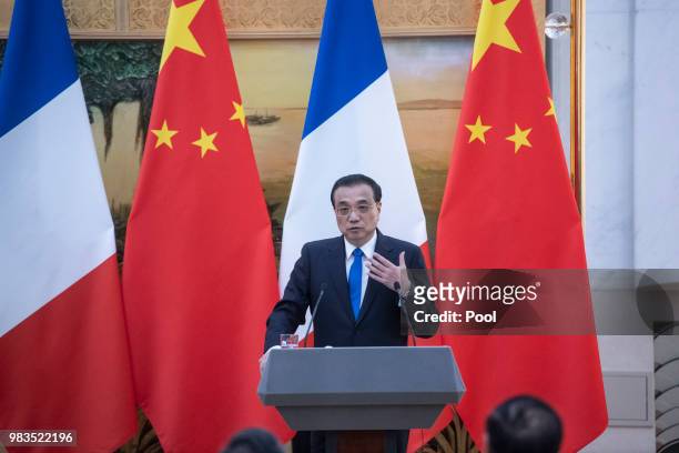 China's Premier Li Keqiang speaks to journalists during a press conference with French Prime Minister Edouard Philippe at the Great Hall of the...