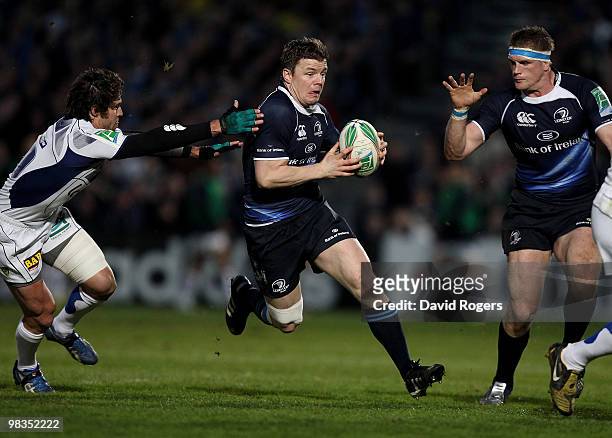 Brian O'Driscoll of Leinster races past Brock James to set up the first Leinster try during the Heinken Cup quarter final match between Leinster and...
