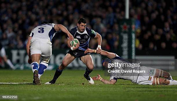 Rob Kearney of Leinster moves past Julein Bonnaire and Dato Zirakashvili during the Heinken Cup quarter final match between Leinster and Clermont...