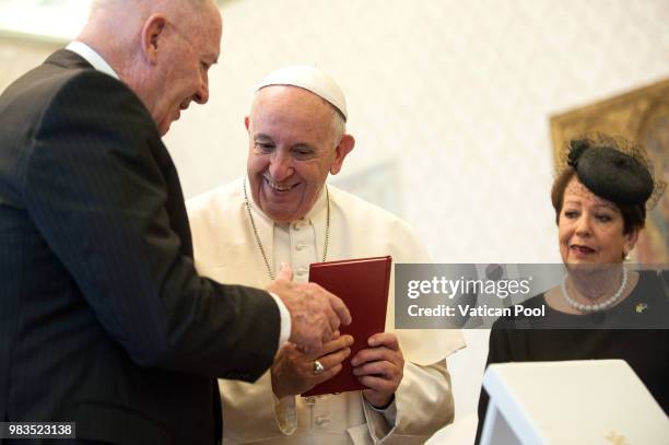 Pope Francis exchanges gifts with the Governor-General of the Commonwealth of Australia Peter Cosgrove and his wife Lady Lynne Cosgrove during an...