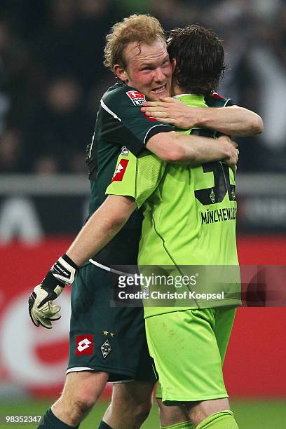 Tobias Levels of Gladbach and Logan Bailly of Gladbach celebrate the 2:0 victory after the Bundesliga match between Borussia Moenchengladbach and...