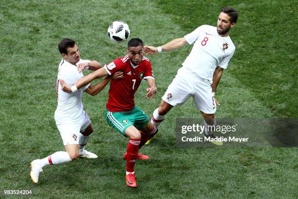 June 20: João Moutinho of Portugal defends Hakim Ziyech of Morocco during the 2018 FIFA World Cup Russia group B match between Portugal and Morocco...