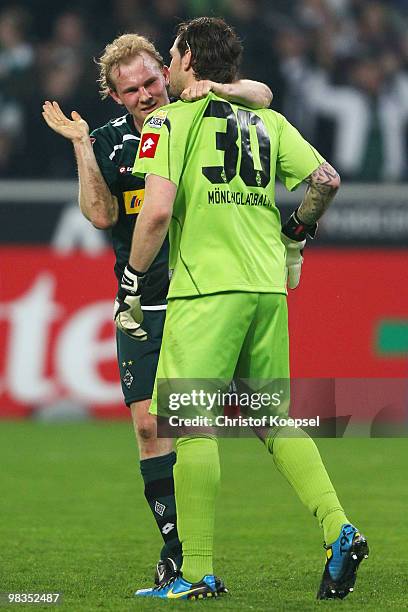 Tobias Levels of Gladbach and Logan Bailly of Gladbach celebrate the 2:0 victory after the Bundesliga match between Borussia Moenchengladbach and...
