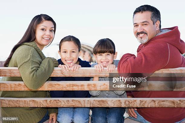 family sitting on bench - double facepalm stock pictures, royalty-free photos & images