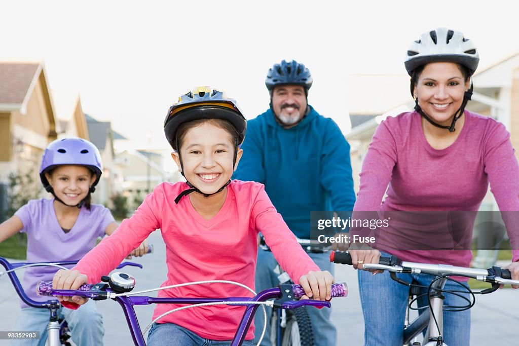 Family riding bicycles together