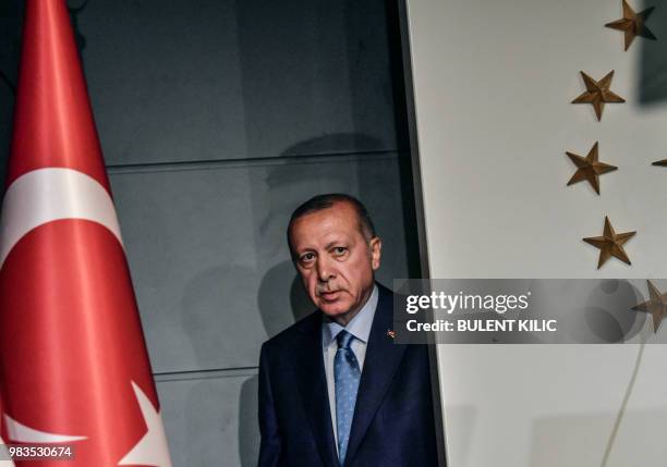 Turkish President Recep Tayyip Erdogan arrives to deliver a speech on June 24, 2018 in Istanbul, after initial results of Turkey's presidential and...