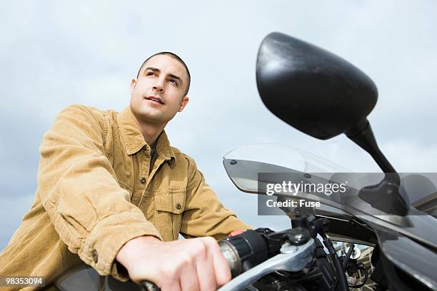 man riding a motorcycle - crew cut stock pictures, royalty-free photos & images