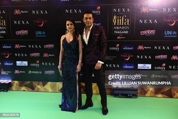 Bollywood actor Bobby Deol and guest arrive for the IIFA Awards of the 19th International Indian Film Academy festival at the Siam Niramit Theatre in...