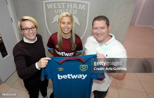West Ham United Ladies Unveil New Signing Gilly Flaherty of West Ham United seen here with Karen Ray and Matt Beard at Rush Green on June 25, 2018 in...