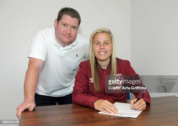 West Ham United Ladies Unveil New Signing Gilly Flaherty of West Ham United seen here with Matt Beard at Rush Green on June 25, 2018 in Romford,...