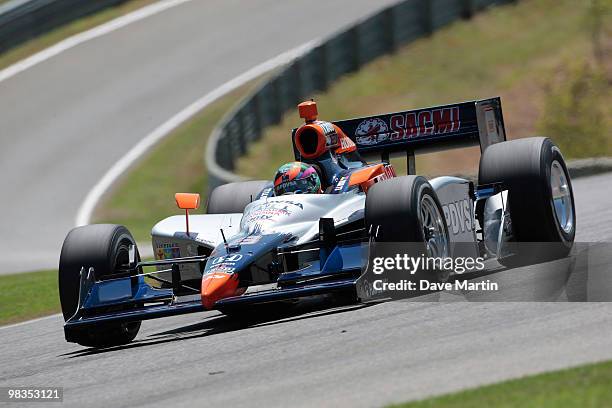 Viso of Veneuela, driver of the KV Racing Technology Dallara Honda races through turn one during practice for the IRL IndyCar Series Grand Prix of...