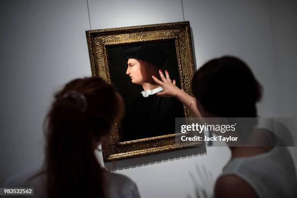 Gallery workers view 'Portrait of a Young Man in Profile', c.1495-1564 by Tommaso di Stefano Lunetti at the Robilant and Voena gallery during a press...