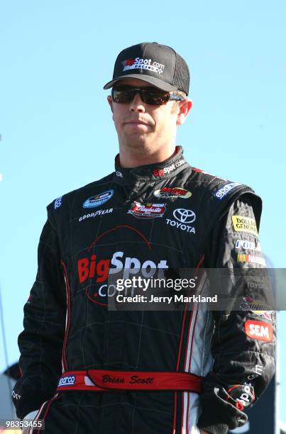 Brian Scott, driver of the BigSpot.com Toyota looks on during practice for the NASCAR Nationwide Series Bashas' Supermarkets 200 at Phoenix...