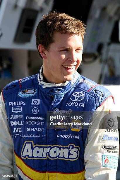 Trevor Bayne, driver of the Aaron's Dream Machine Toyota, looks on during practice for the NASCAR Nationwide Series Bashas' Supermarkets 200 at...