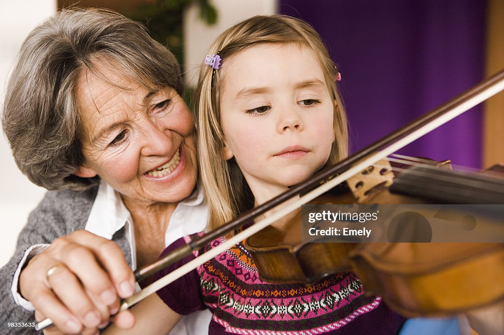 Grandma teaching grandchild music