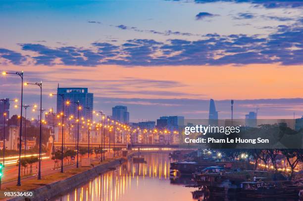 aerial view of skyscrapers in ho chi minh city at sunrise, viewed from tau hu canal. - ho chi minh city 個照片及圖片檔