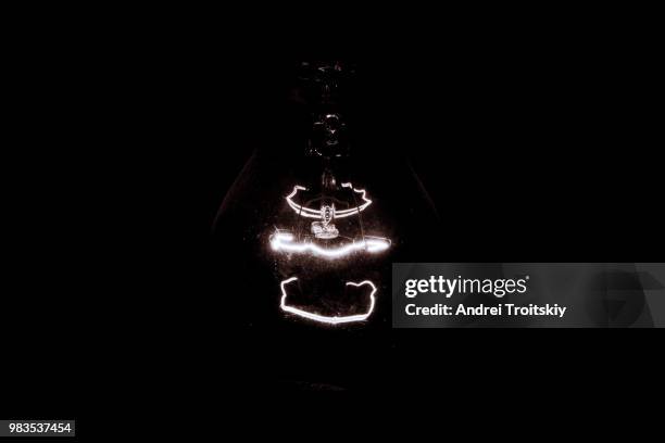 a lamp in the attic in total darkness - total blackout stock pictures, royalty-free photos & images