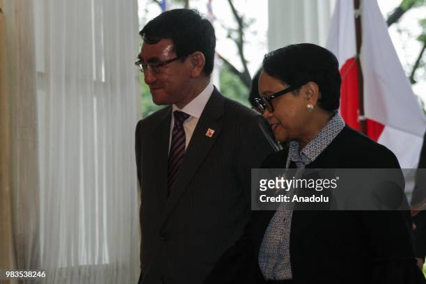 Minister of Foreign Affairs of the Republic of Indonesia, Retno Marsudi walks with Foreign Minister of Japan, Taro Kono ahead of the sixth strategic...