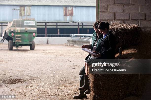 business woman advising farmer - colin hawkins stock pictures, royalty-free photos & images