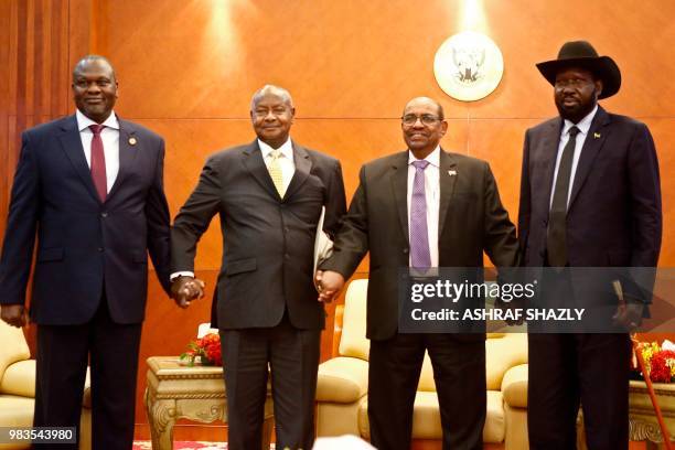 From left to right, South Sudan's opposition leader Riek Machar, Ugandan President Yoweri Museveni, Sudanese President Omar al-Bashir and South...