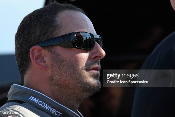 Johnny Sauter ISM Connect Chevrolet Silverado talks with his crew after qualifying for the NASCAR Camping World Truck Series Villa Lighting delivers...