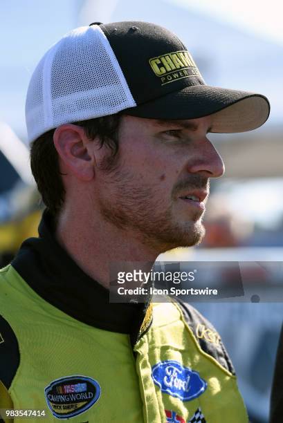 Grant Enfinger Curb Racing Ford F-150 debriefs with his crew after his pole winning qualifying run for the NASCAR Camping World Truck Series Villa...