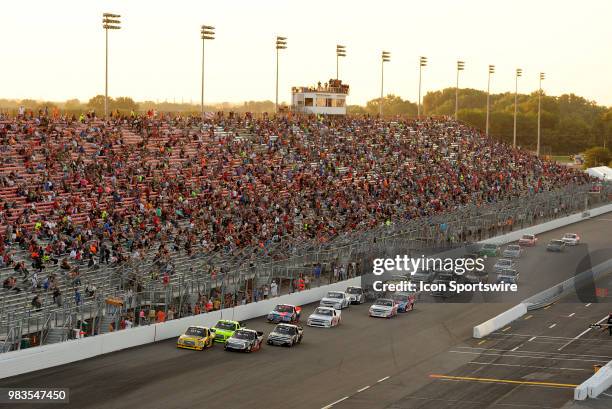 The field works their way down the front stretch during the NASCAR Camping World Truck Series Villa Lighting delivers the Eaton 200 presented by CK...