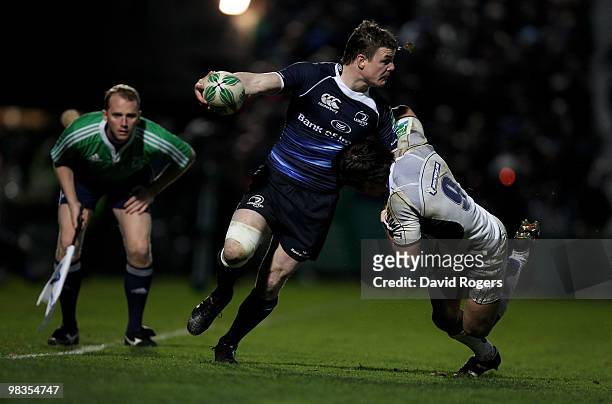 Brian O'Driscoll of Leinster holds off Morgan Parra during the Heinken Cup quarter final match between Leinster and Clermont Auvergne at the RDS on...