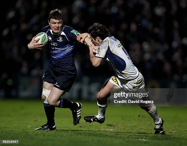 Brian O'Driscoll of Leinster holds off Morgan Parra during the Heinken Cup quarter final match between Leinster and Clermont Auvergne at the RDS on...