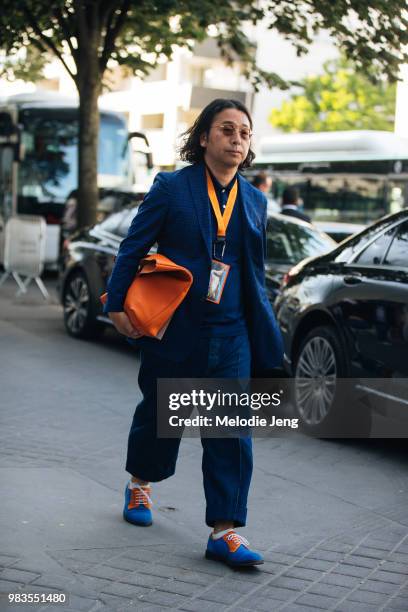 Guest in a blue suit during Paris Mens Fashion Week Spring/Summer 2019 on June 24, 2018 in Paris, France.