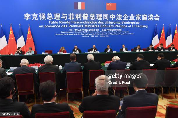 Chinese Premier Li Keqiang and French Prime Minister Edouard Philippe meet with French business leaders and entrepreneur at the Great Hall of the...