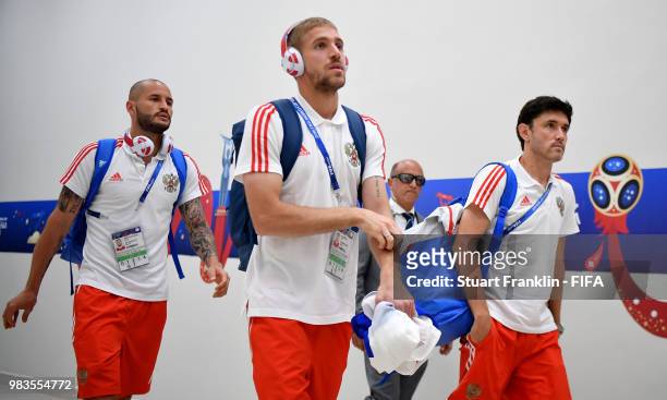 Yury Zhirkov, Iury Gazinsky and Fedor Kudriashov of Russia arrive at the stadium prior to the 2018 FIFA World Cup Russia group A match between...