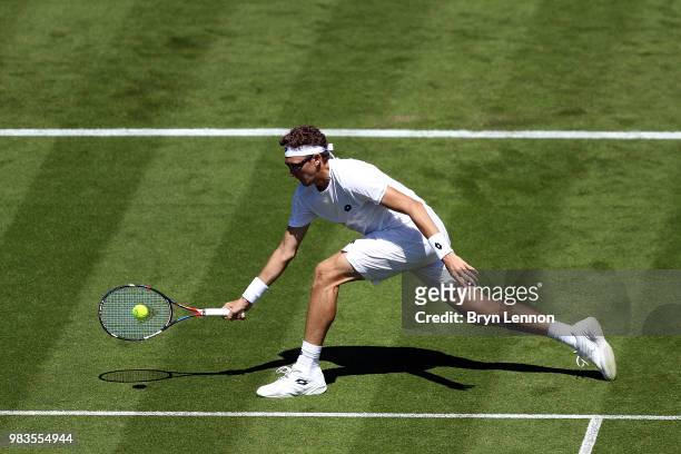 Denis Istomin of Uzbekistan in action against Andreas Speppi of Italy during Day four of the Nature Valley International at Devonshire Park on June...