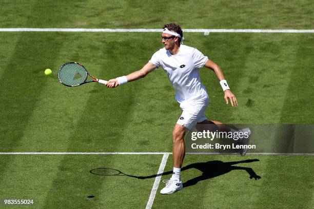 Denis Istomin of Uzbekistan in action against Andreas Speppi of Italy during Day four of the Nature Valley International at Devonshire Park on June...