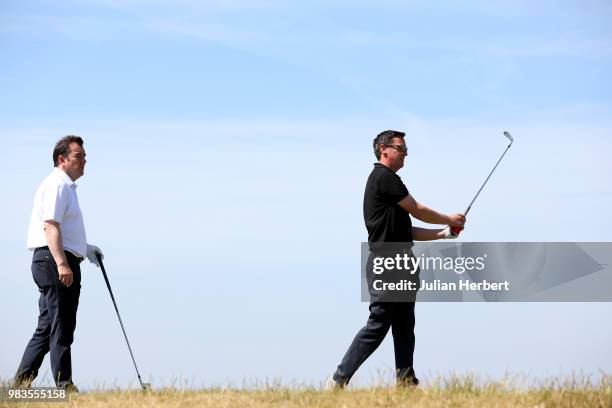 Albert Mackenzie of Saunton Golf Club watches his partner Phil Waterton play a shot during The Lombard Trophy South West Qualifier at Royal North...