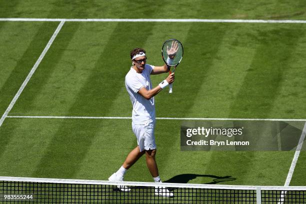 Denis Istomin of Uzbekistan waves to the crowd after beating Andreas Seppi of Italy during Day four of the Nature Valley International at Devonshire...