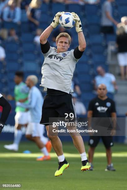 Sporting Kansas City goalkeeper Tim Melia warms up before an MLS match between the Houston Dynamo and Sporting Kansas City on June 23, 2018 at...