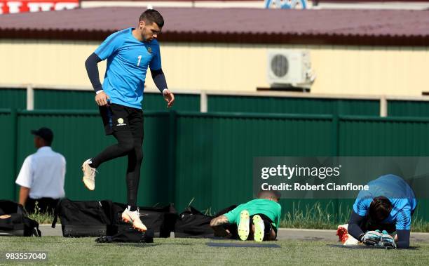 Mathew Ryan of Australia warms up during a training session during an Australian Socceroos media opportunity at Park Arena on June 25, 2018 in Sochi,...