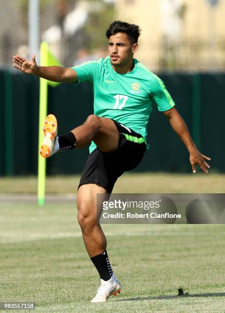 Daniel Arzani of Australia stretches during a training session during an Australian Socceroos media opportunity at Park Arena on June 25, 2018 in...