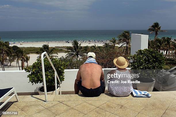 Robin Grote and Barbara Grote, on vacation from Pennsylvania, take in the sights as they relax at The Strand, Ocean Drive Hotel on April 9, 2010 in...