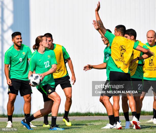 Australia's midfielder Jackson Irvine and team mates vie for the ball during a training session at the Park Arena in Sochi on June 25 on the eve of...