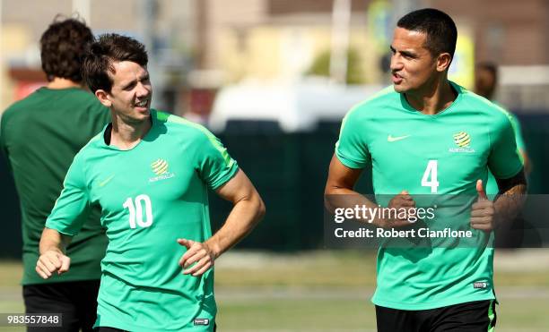 Robbie Kruse of Australia and Tim Cahill of Australia run on during a training session during an Australian Socceroos media opportunity at Park Arena...