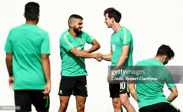 Aziz Behich of Australia speaks with Robbie Kruse of Australia during a training session during an Australian Socceroos media opportunity at Park...