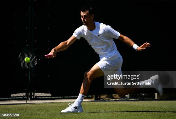 Bernard Tomic of Australia in action against Matteo Donati of Italy during the Wimbledon Lawn Tennis Championships Qualifying at The Bank of England...