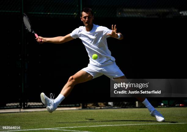 Bernard Tomic of Australia in action against Matteo Donati of Italy during the Wimbledon Lawn Tennis Championships Qualifying at The Bank of England...